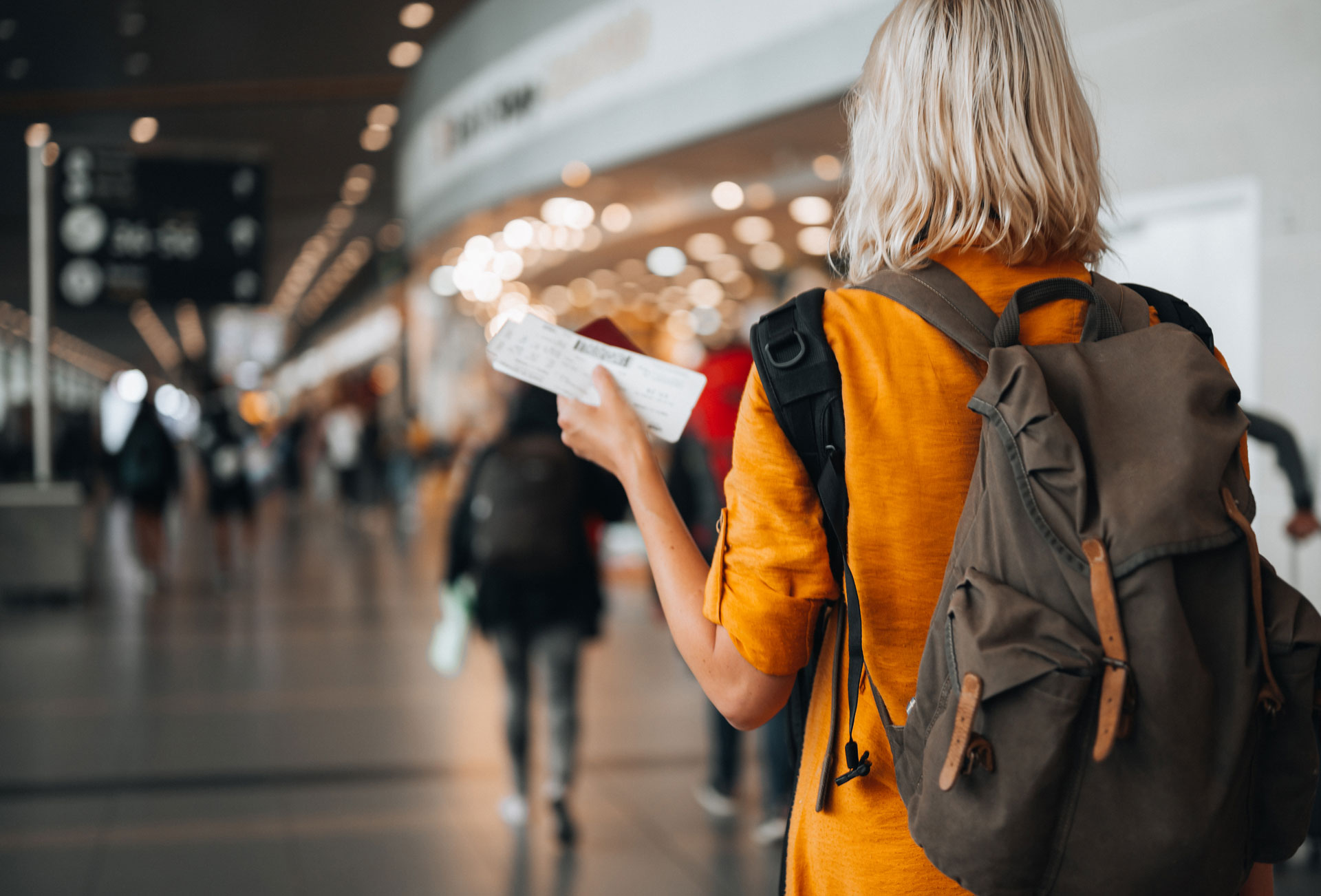 Person walking with a ticket